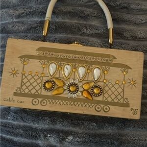 Elegant Tan Cable Car Clutch